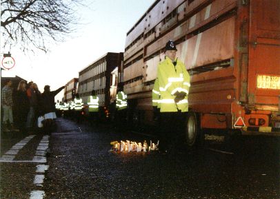 candlelit vigil with trucks